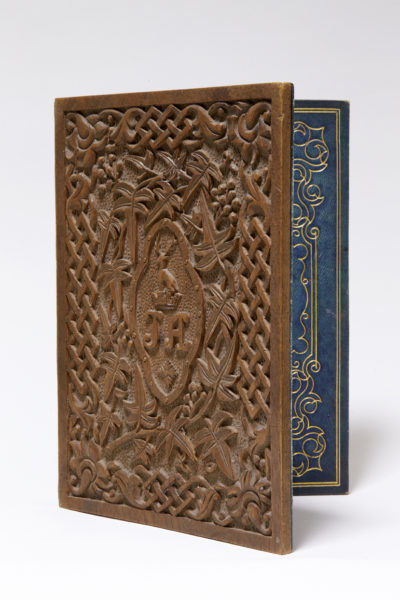 Carved wooden letter case, propped open