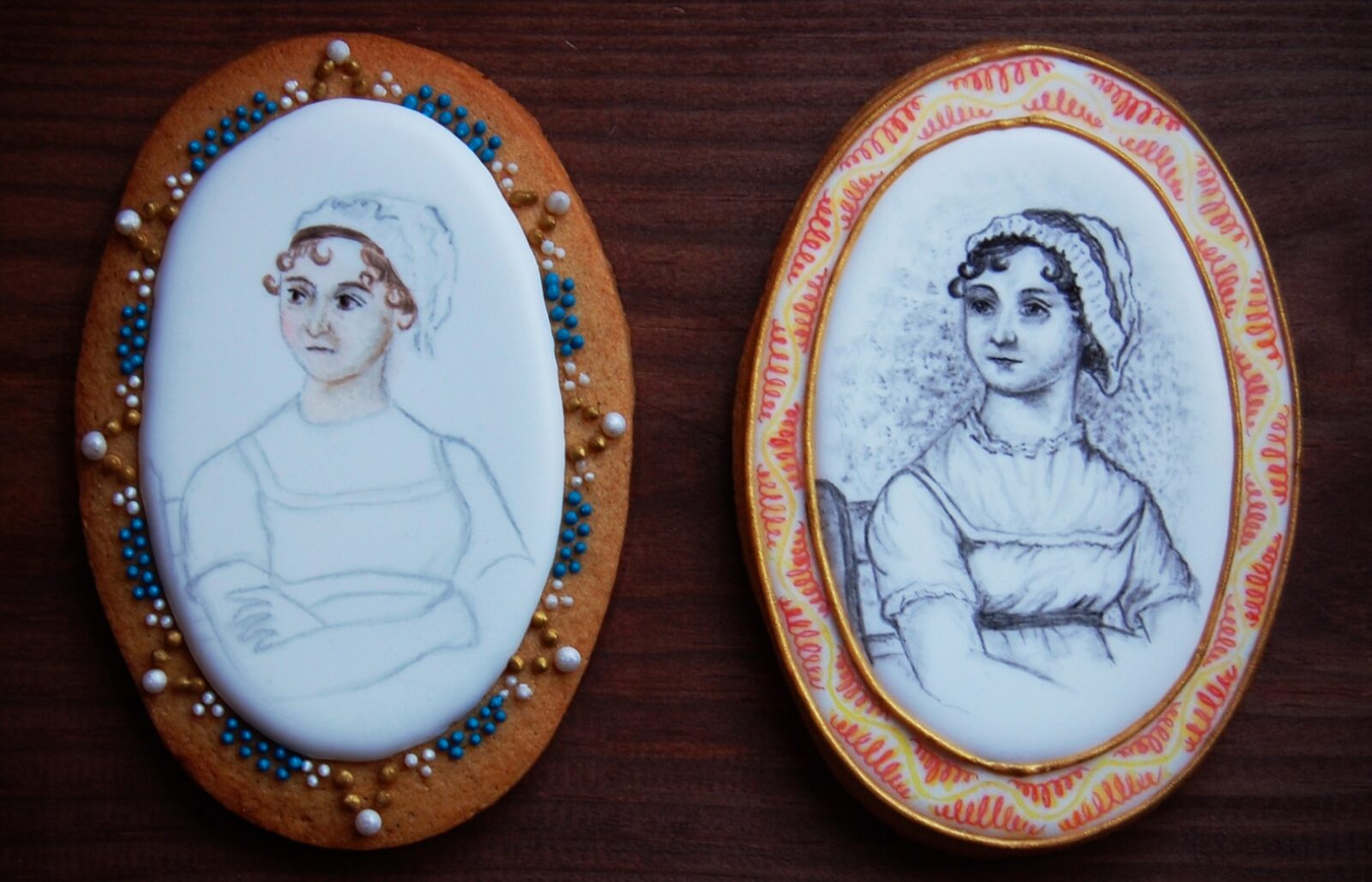 Two oval biscuits with Jane Austen's portrait painted on them in icing. ©Ella Hawkins