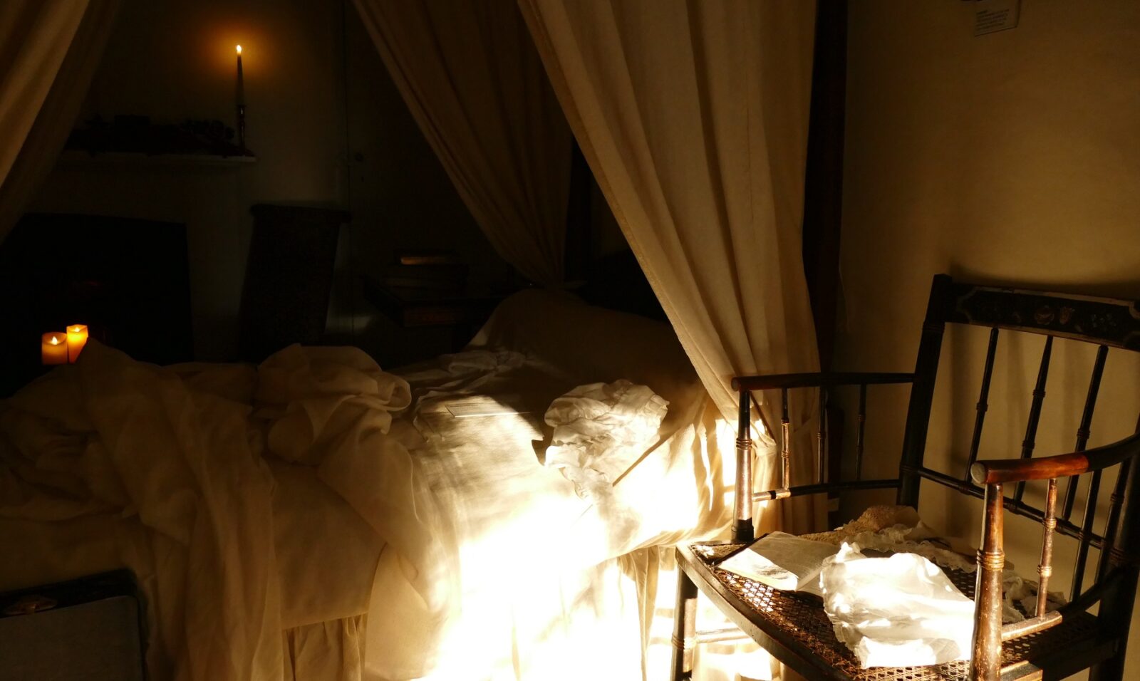 In Jane Austen's bedroom, the scene of her birth is recreated with tousled sheets and baby muslins