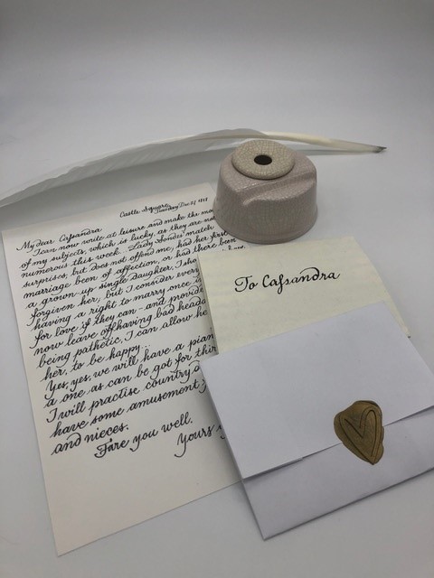Example letter, quill and ink pot. Image by Alejandra Gonaldi