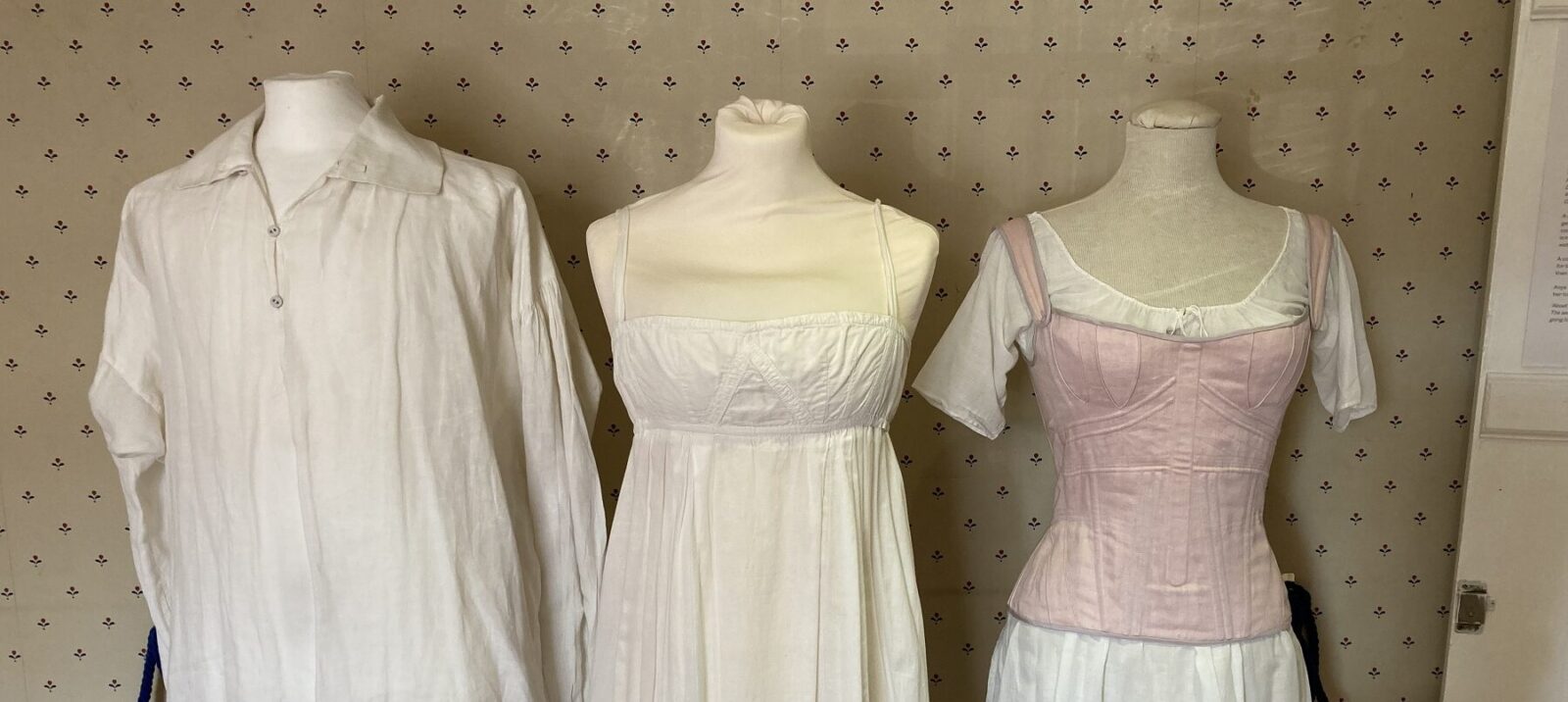 Costume articles on display, L-R: Mr Darcy's white shirt, Lizzy Bennet's muddy petticoat, Emma's pink corset