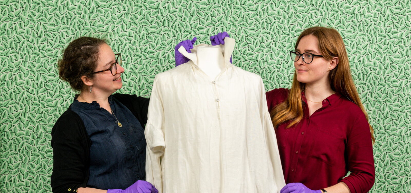 Pictured:  (left/right) Lizzie Dunford and Rebecca Wood with the Colin Firth shirt at the Jane Austen's House, Museum in Chawton, Hampshire.

It was once voted the most memorable moment in British TV drama history.  Now fans of Colin Firth's iconic portrayal of Pride and Prejudice's Mr Darcy can see in the flesh the famous sodden white shirt in which he enchanted Elizabeth Bennet.

But ardent admirers of both the classic novel and the Oscar-winning actor have been teasingly warned that hugging the garment would be a step too far.  The shirt is the centrepiece of a major new exhibition opening today (Saturday) at Jane Austen's House in Hampshire.  SEE OUR COPY FOR DETAILS.

© Jordan Pettitt/Solent News & Photo Agency
UK +44 (0) 2380 458800