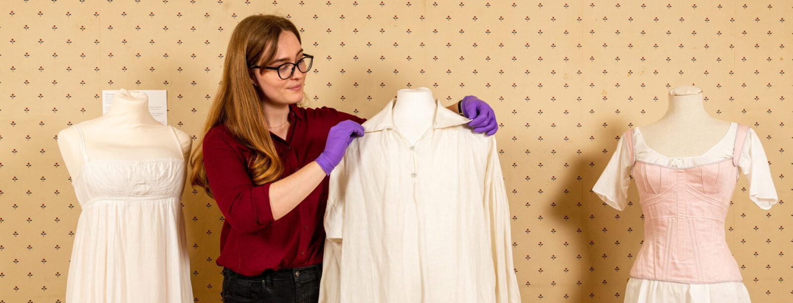 Pictured:  Rebecca Wood with the Colin Firth shirt and (on left) a petticoat worn by Elizabeth Bennet, (made famous by its “six inches deep in mud”), also from the 1995 BBC adaptation of Pride and Prejudice, and (on right) Emma Woodhouse’s stays, worn by Anya Taylor Joy in the 2020 film adaptation of Emma on show at the Jane Austen's House, Museum in Chawton, Hampshire.

It was once voted the most memorable moment in British TV drama history.  Now fans of Colin Firth's iconic portrayal of Pride and Prejudice's Mr Darcy can see in the flesh the famous sodden white shirt in which he enchanted Elizabeth Bennet.

But ardent admirers of both the classic novel and the Oscar-winning actor have been teasingly warned that hugging the garment would be a step too far.  The shirt is the centrepiece of a major new exhibition opening today (Saturday) at Jane Austen's House in Hampshire.  SEE OUR COPY FOR DETAILS.

© Jordan Pettitt/Solent News & Photo Agency
UK +44 (0) 2380 458800