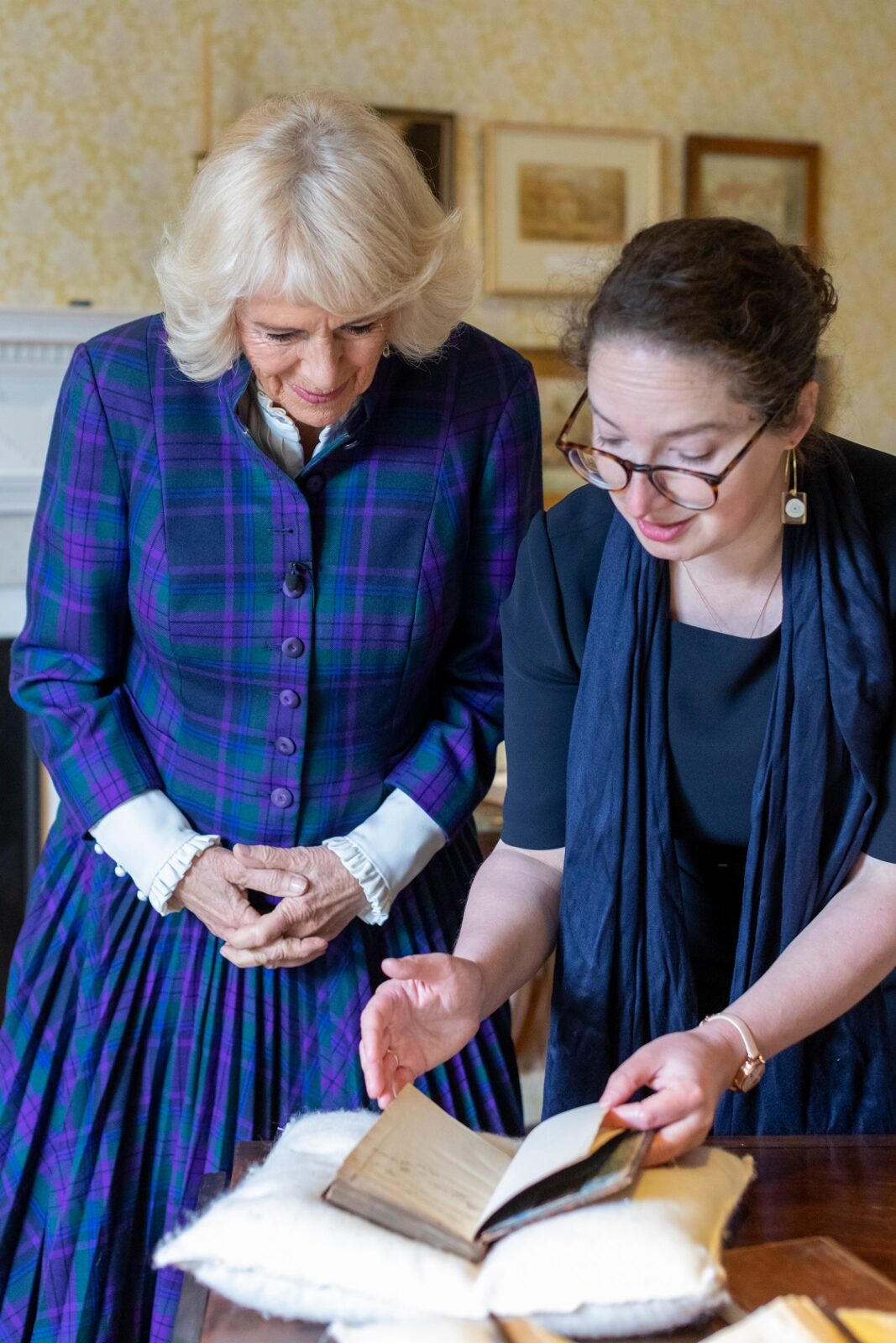 HRH The Duchess of Cornwall with Director Lizzie Dunford and a first edition of Pride and Prejudice.