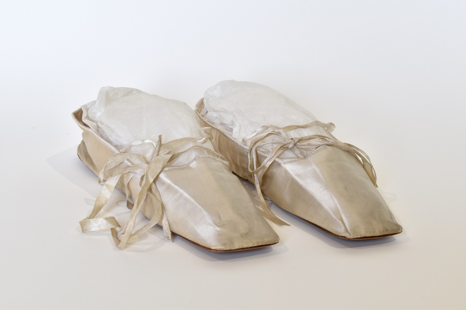 A pair of ivory silk slippers belonging to Jane Austen's niece, Marianne Knight