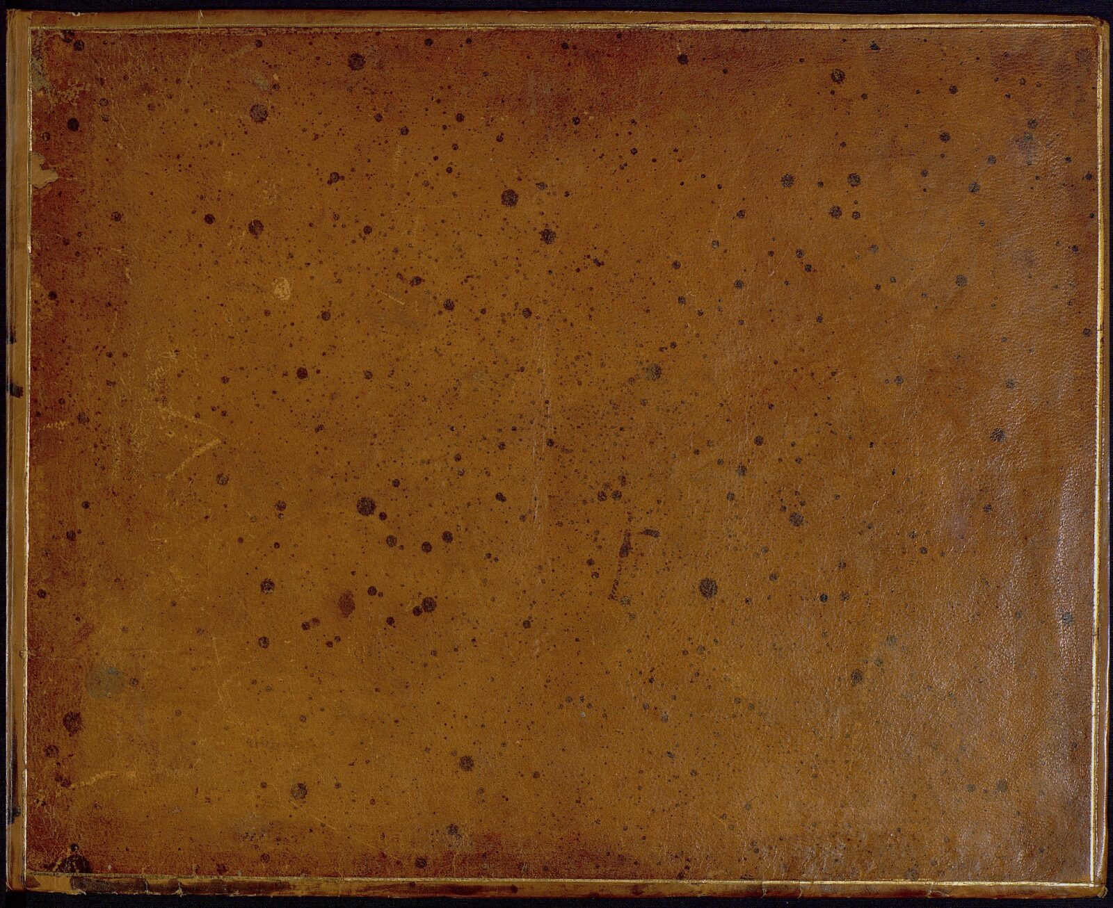 Brown leather front cover of a manuscript book of vocal music in Jane Austen’s hand