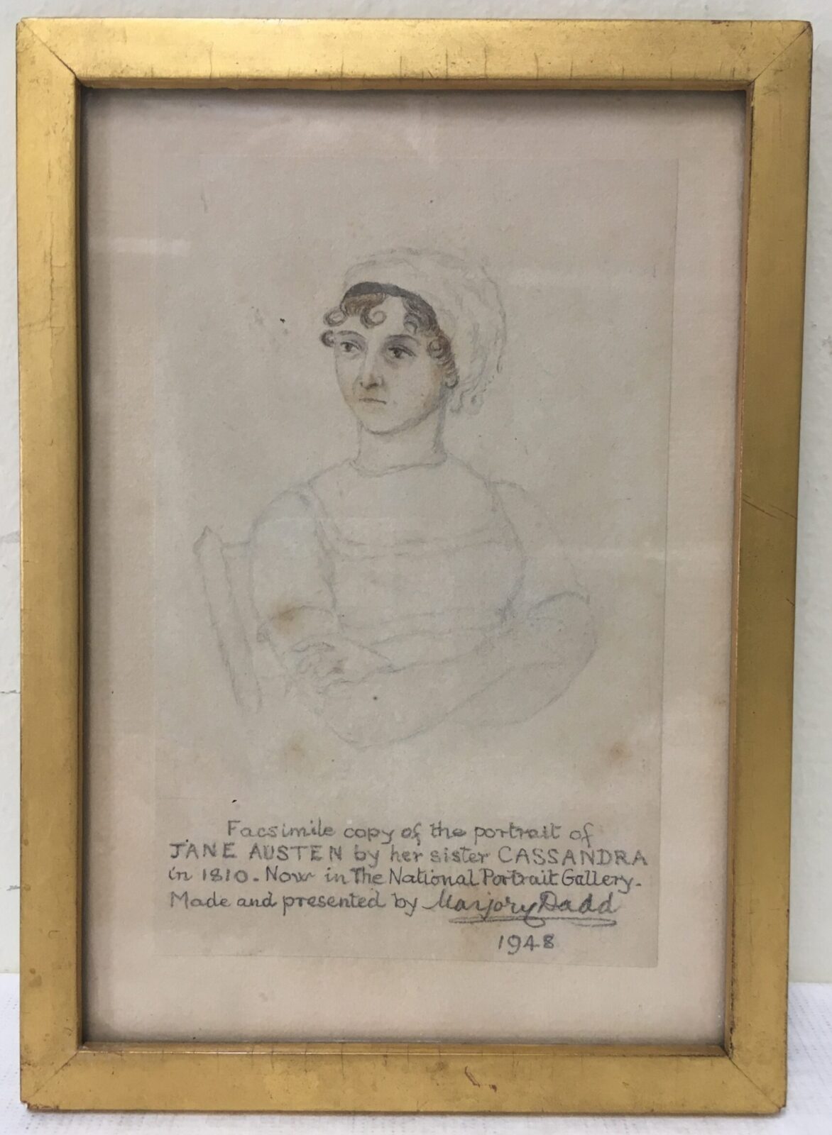 A facsimile copy of the portrait of Jane Austen by her sister Cassandra, reproduced in 1948 by Marjorie Dadd from the portrait in the National Portrait Gallery collection.