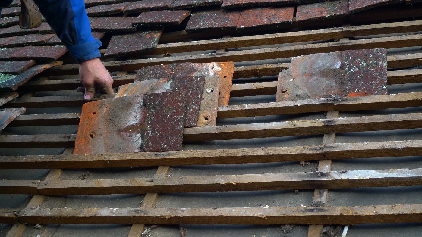 Old tiles being sorted on the roof of Jane Austen's House, October 2021