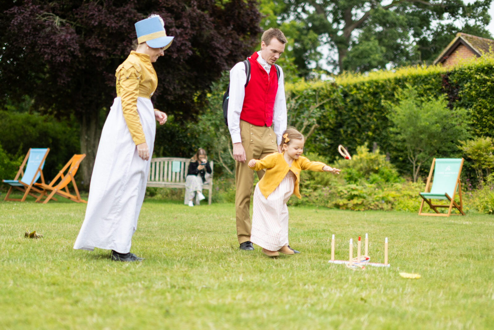 Family playing Regency garden games at Jane Austen's House.