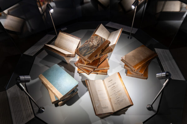 A close up of six first editions of Jane Austen's novels