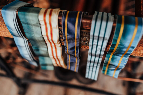 Colourful ribbons inspired by Jane Austen and Jane Austen's House, woven at Whitchurch silk mill draped over a heritage loom.